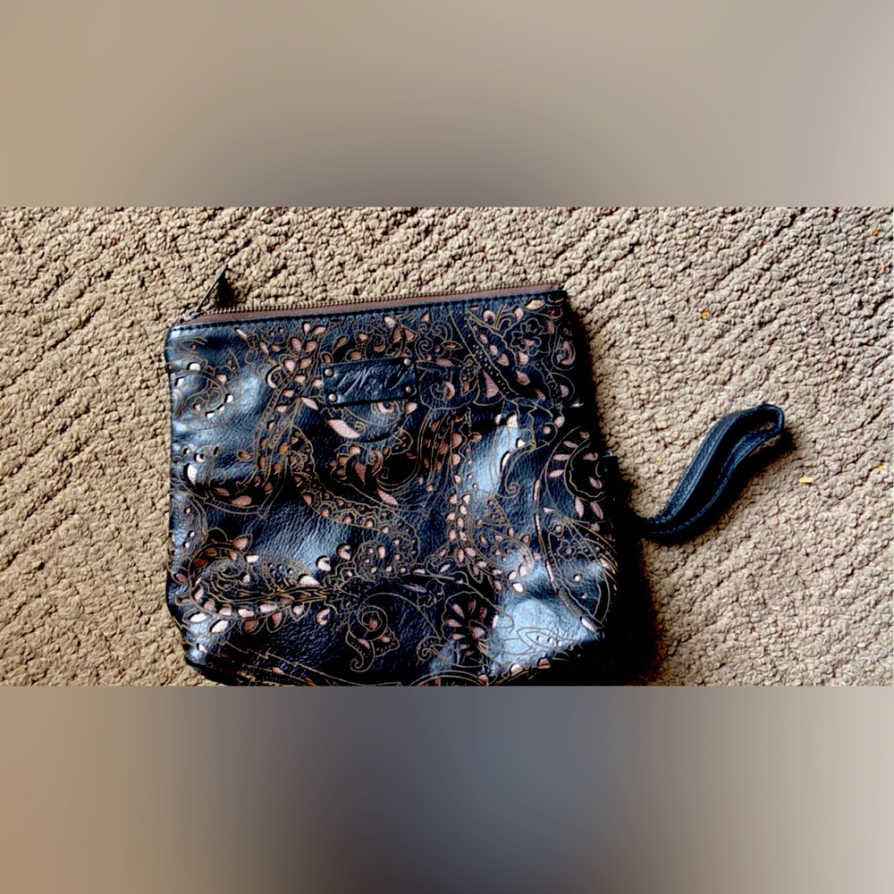 Patricia Nash clutch. It does fold in half. I love it, but just don’t use it.